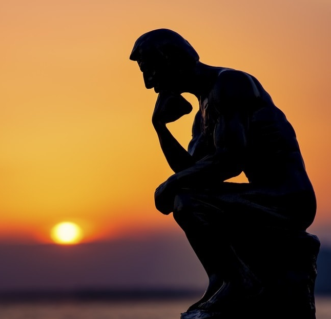 Thinking man in the sunset